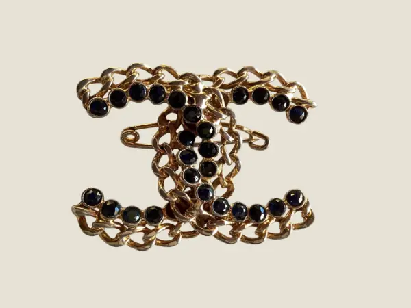 Vintage Chanel Logo Brooch | Intertwined Double C Sapphire, Two-Tone Gold Plated Early 1950s